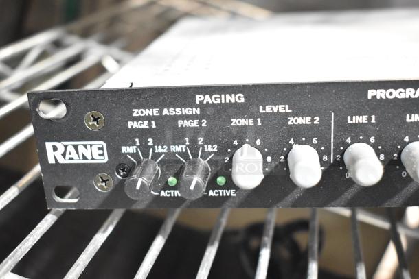Rane CP 64S Commercial Processor, black metal casing, zone assign and level controls, used condition, visible on rack.