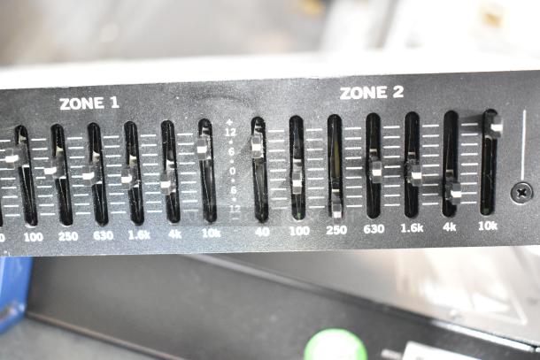 Rane CP 64S Commercial Processor showing Zone 1 and 2 equalizer sliders with frequency and decibel markings.