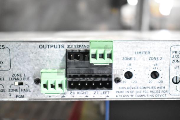 Close-up of outputs on Rane CP 64S Commercial Processor showing connections and limiters for Zone 1 and Zone 2.