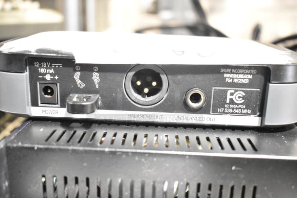 Shure PG4 receiver with internal antenna diversity, showing power input and balanced/unbalanced outputs.