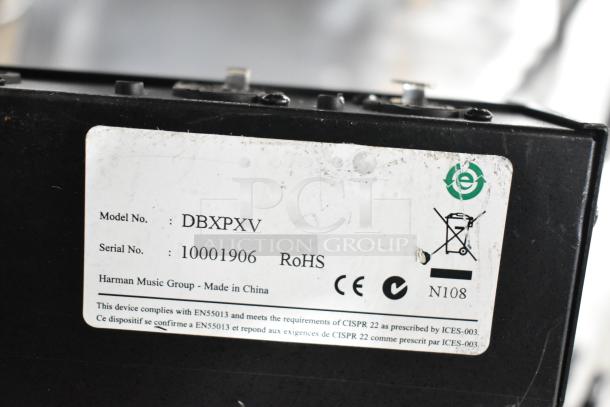 DBX Professional Products DriveRack PX label showing Model No. DBXPXV and Serial No. 10001906, made by Harman Music Group.