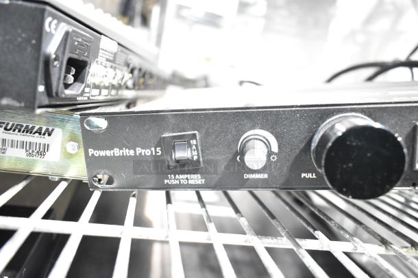 Shure PG4, DBX DriveRack PX, Samson PowerBrite Pro15 on shelf. Pro15 features dimmer, reset, labeled connections.