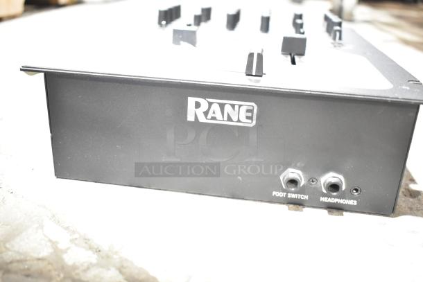 Rane TTM 57SL Performance Mixer, black, front view showing headphone and foot switch ports.