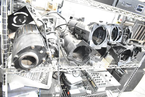 9 GoboSource ES-B10E stage lights on metal shelving, showing robust construction. Ideal for stage setups.