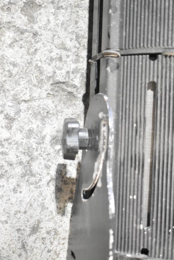 Close-up of a GoboSource ES-B10E stage light, showcasing the adjustment knob and vented exterior.