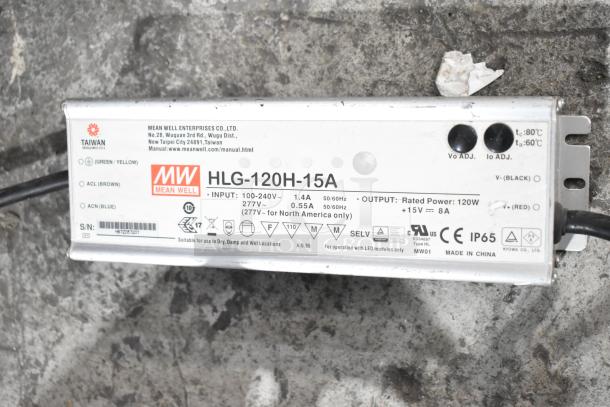"Mean Well HLG-120H-15A power supply, 120W, IP65 rating, suitable for LED modules, visible input/output specs, Made in China."