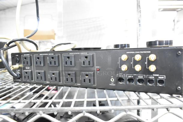 Panamax M5100-PM Home Theater Power Conditioner with multiple outlets, LAN, phone ports, coax protection; good condition.