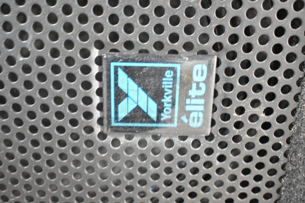 Yorkville Elite speaker grill with a visible Yorkville logo. Durable, with signature perforated design for optimum sound.