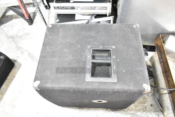 Yorkville Elite E12 speaker; black, durable design. Visible wear on corners. Handle on top for portability.