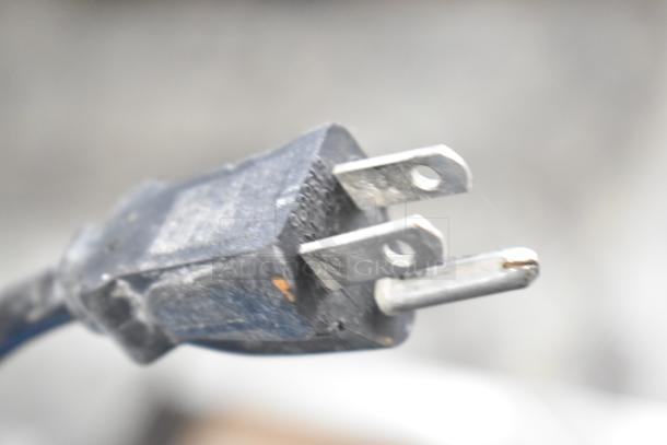 Close-up of a worn three-prong electrical plug, part of speaker set including Yorkville Elite E12 and LS700P for auction.