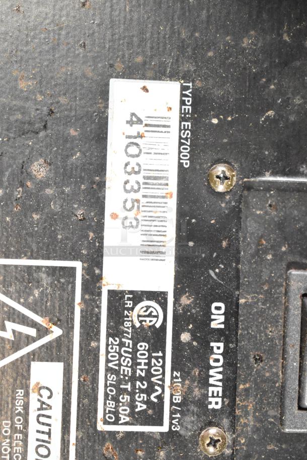 Close-up of Yorkville LS700P speaker label, showing model number, power specifications, and usage instructions.