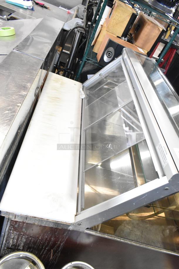 Federal Industries SQ4CD deli display case, glass panels, floor style, 120V, 1 phase, minor wear visible.