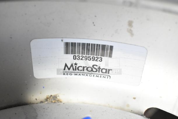 Two Sixth Barrel Kegs, branded by MicroStar Keg Management, showing a barcode and serial number 03295923.