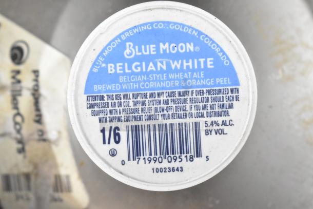 Two Blue Moon Belgian White sixth barrel kegs, 1/6 size, featuring Belgian-style wheat ale brewed with coriander and orange peel.