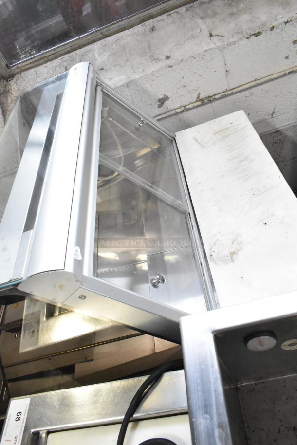 Federal Industries SQ3CB deli display case, commercial floor style. Features glass front, shelves, visible wear. 120V, 1 phase.