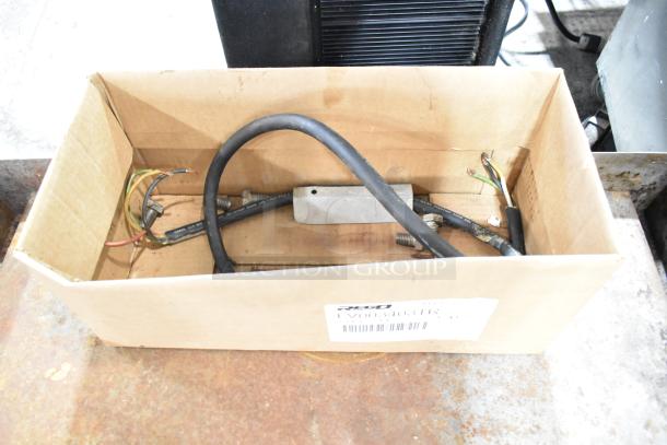 Cardboard box containing various cables and connectors, labeled with product code LV003403TR.