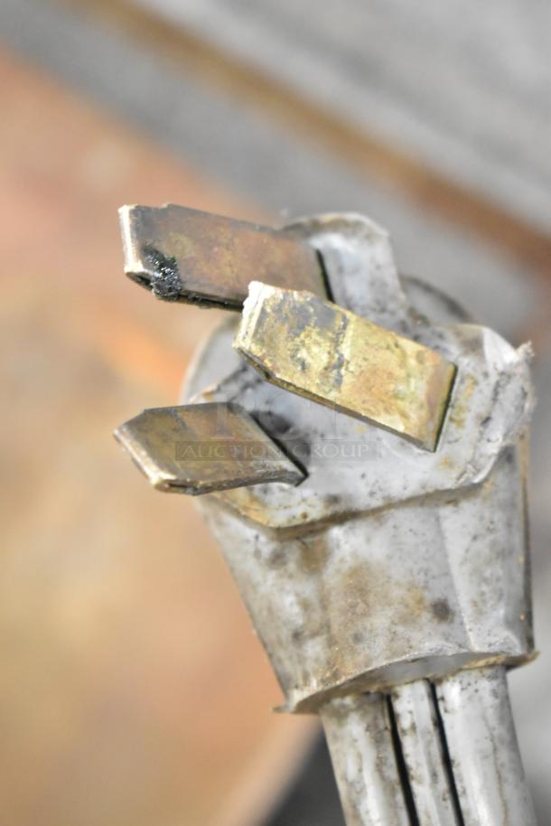 Corroded electrical plug of Star commercial countertop electric griddle, indicating wear. Dual side grease trays not visible.