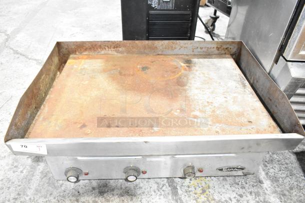 Star Commercial Electric Flat Top Griddle, used condition, dual side grease trays, visible rust on cooking surface.