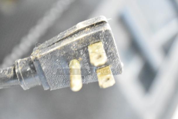Power plug of True T-23FG-LD Commercial Freezer, showing wear but functional. 115 Volts, 1 Phase.