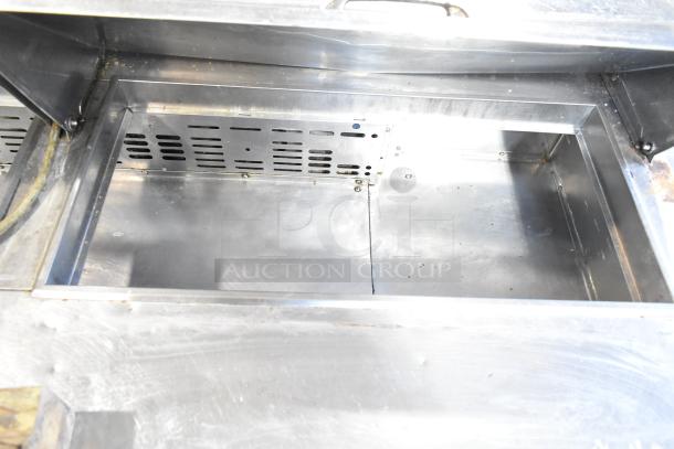 Turbo Air MST-72 prep table interior, stainless steel, showing storage compartment and venting. Commercial use.