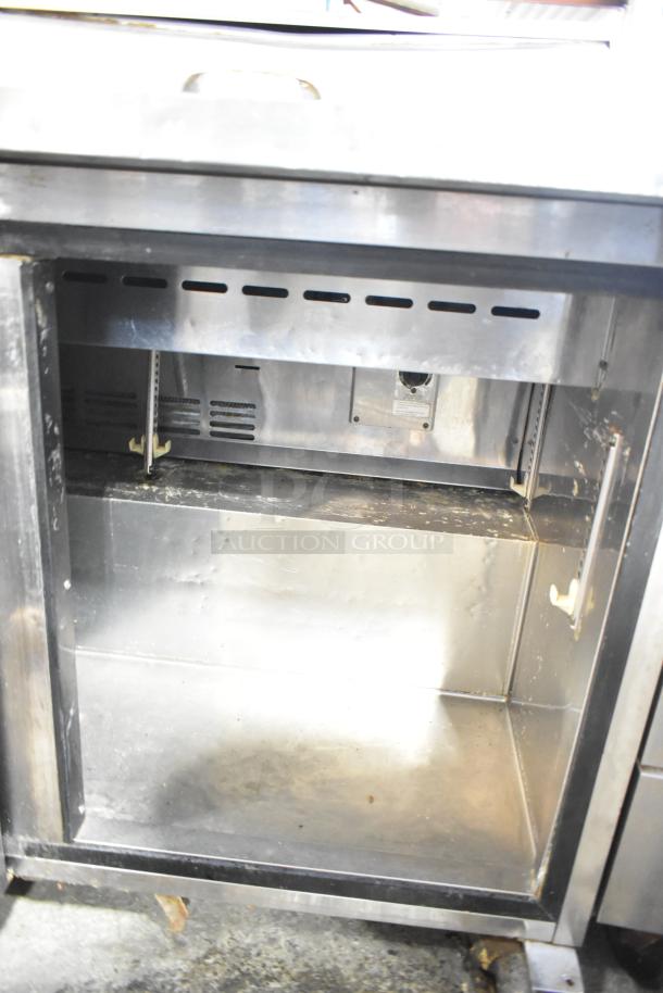 Turbo Air MST-72 Mega Top prep table, stainless steel, visible wear, 115V, commercial casters, Bain Marie compartment.