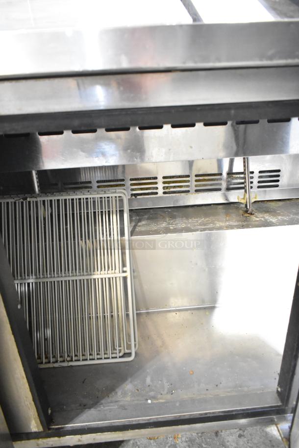 Turbo Air MST-72 commercial sandwich prep table, stainless steel, on casters, 115 volts, interior view showing shelves.
