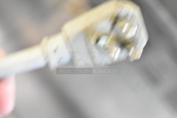 The image is blurry and does not clearly show the Turbo Air MST-72 sandwich prep table.