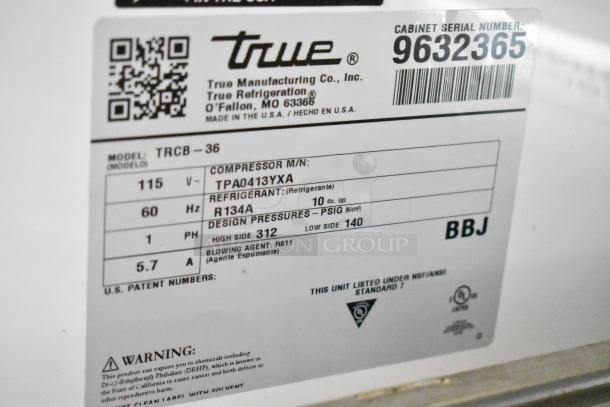 2019 True TRCB-36 16GA commercial chef base label showing model, voltage, and refrigerant details.