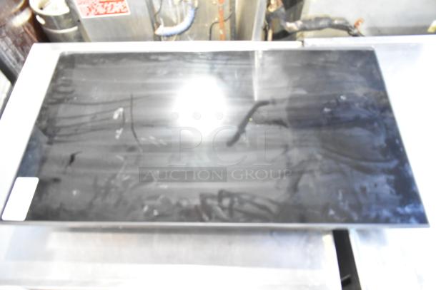 Samsung BE43D-H 43" television, black screen, some surface reflections. Requires local pickup. Model clearly visible.