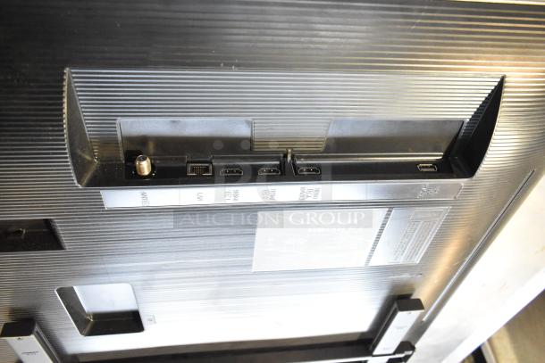 Samsung BE43D-H 43" TV back panel showing ports: antenna, LAN, HDMI, and power connections.