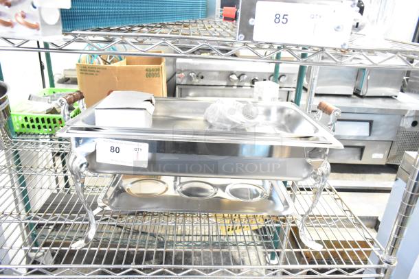 Brand new countertop chafer on metal shelf; minor scratches visible. Includes wooden handles and stainless steel finish. Lot number 80.