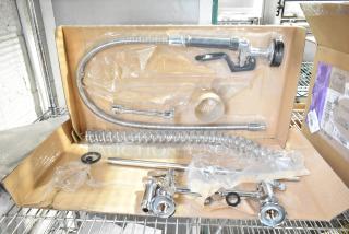 Brand new spray nozzle attachment in box, chrome finish, includes hose and mounting hardware, slightly scratched and dented.