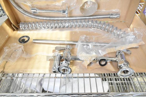 Brand new spray nozzle attachment in packaging with chrome components and slight packaging wear. Includes hose and installation parts.