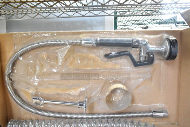 "Brand new scratch and dent spray nozzle attachment in packaging, featuring a coiled metal hose and chrome finish."