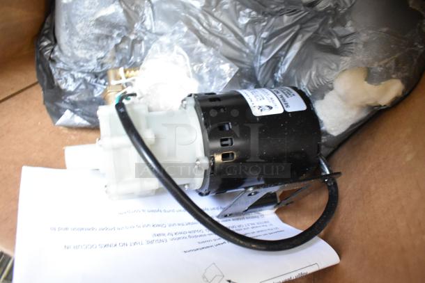 Brand new pump assembly, scratch and dent condition, 115 volts, 1 phase, visible tags and wiring shown.