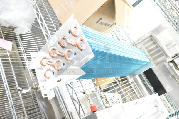 Brand new 17404070621 17812873HC evaporator coil, scratch and dent condition, visible copper tubing and blue fins.