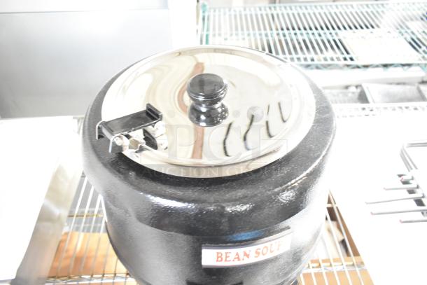 Brand new Avantco 177S30 11 Qt. black soup kettle warmer; 120 volts, 1 phase. "Bean Soup" label. Slight scratches.