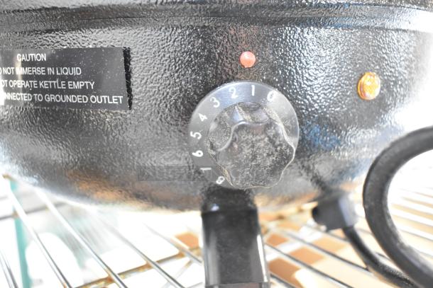 11 Qt. Avantco S30 black soup kettle warmer, new but scratch and dent. Features temperature dial, warning labels visible.