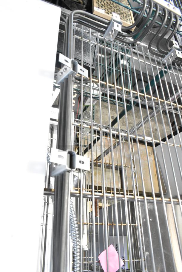 New burner with minor scratches and dents, metal construction, grid pattern and secured with brackets; suitable for replacement.