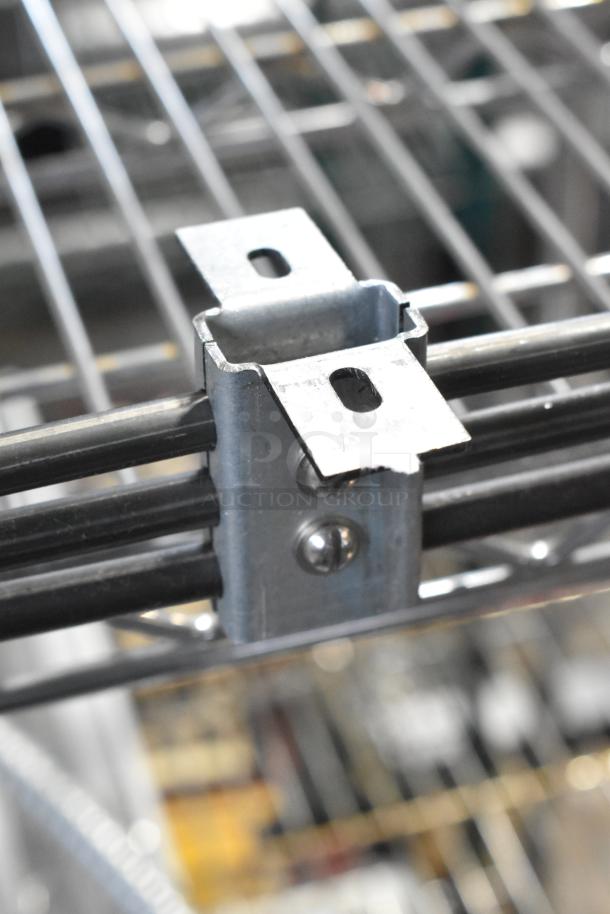 Metal burner component with mounting bracket, brand new but with minor scratches. Ideal for replacement or repair.