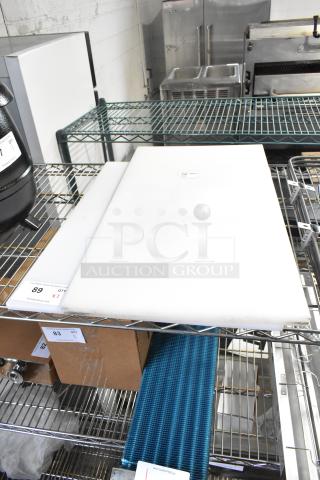2 new scratch and dent white cutting boards, including Choice model 40724185WH, 24"x18"x1/2", polyethylene.