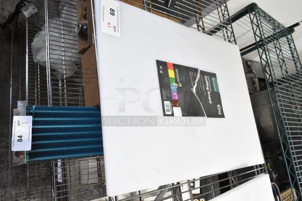 2 new Choice 24"x18"x1/2" white polyethylene cutting boards. Scratch and dent condition. Tags show auction details.