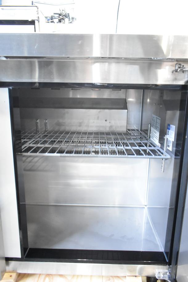 Brand new Avantco 178AU48R 2-door undercounter cooler, scratch and dent, stainless steel, 115V, 1 phase, interior view.