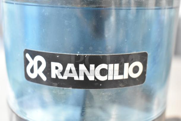 Rancilio Rocky Doser espresso grinder, no lid, 110V, 1 phase. Features Rancilio logo. Some surface marks visible.