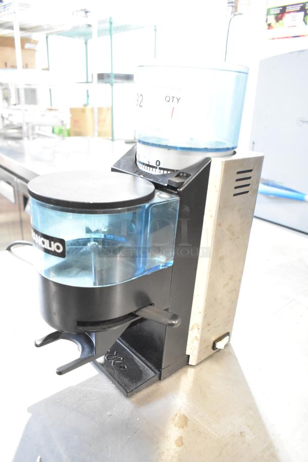 Rancilio Rocky Doser espresso grinder, 110V, missing lid, used condition. Model features adjustable grind settings.