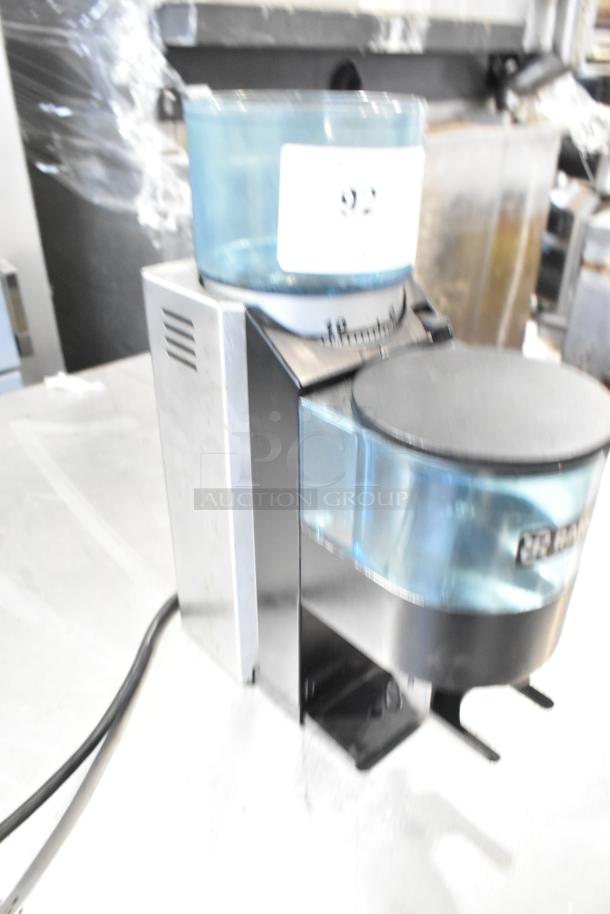 Rancilio Rocky Doser espresso bean grinder, no lid, 110 volts, 1 phase. Used condition, features metal construction with doser.