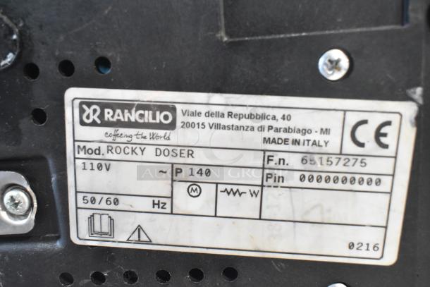Rancilio Rocky Doser espresso bean grinder label showing model details, voltage 110V, and Made in Italy marking. No lid included.