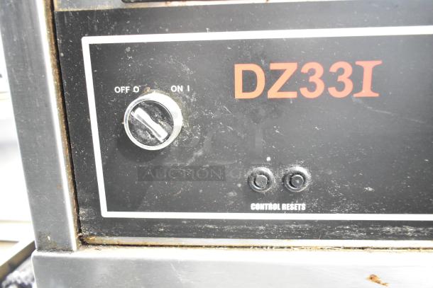 Middleby Marshall DZ33I control panel showing power switch and control resets, part of a stainless steel commercial pizza oven.