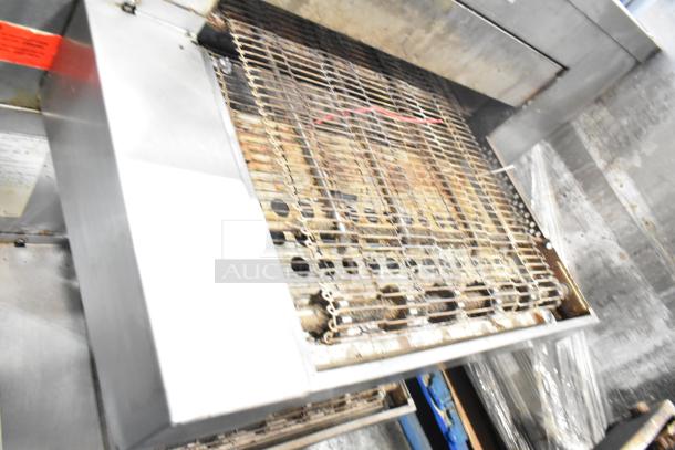 Middleby Marshall CTX DZ33I stainless steel commercial conveyor pizza oven on casters, 208V, in used condition.