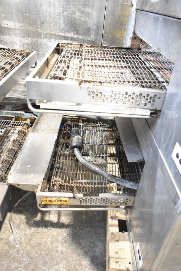 2 Middleby Marshall CTX DZ33T stainless steel conveyor pizza ovens on casters, 208V, 3/1 phase; used condition.